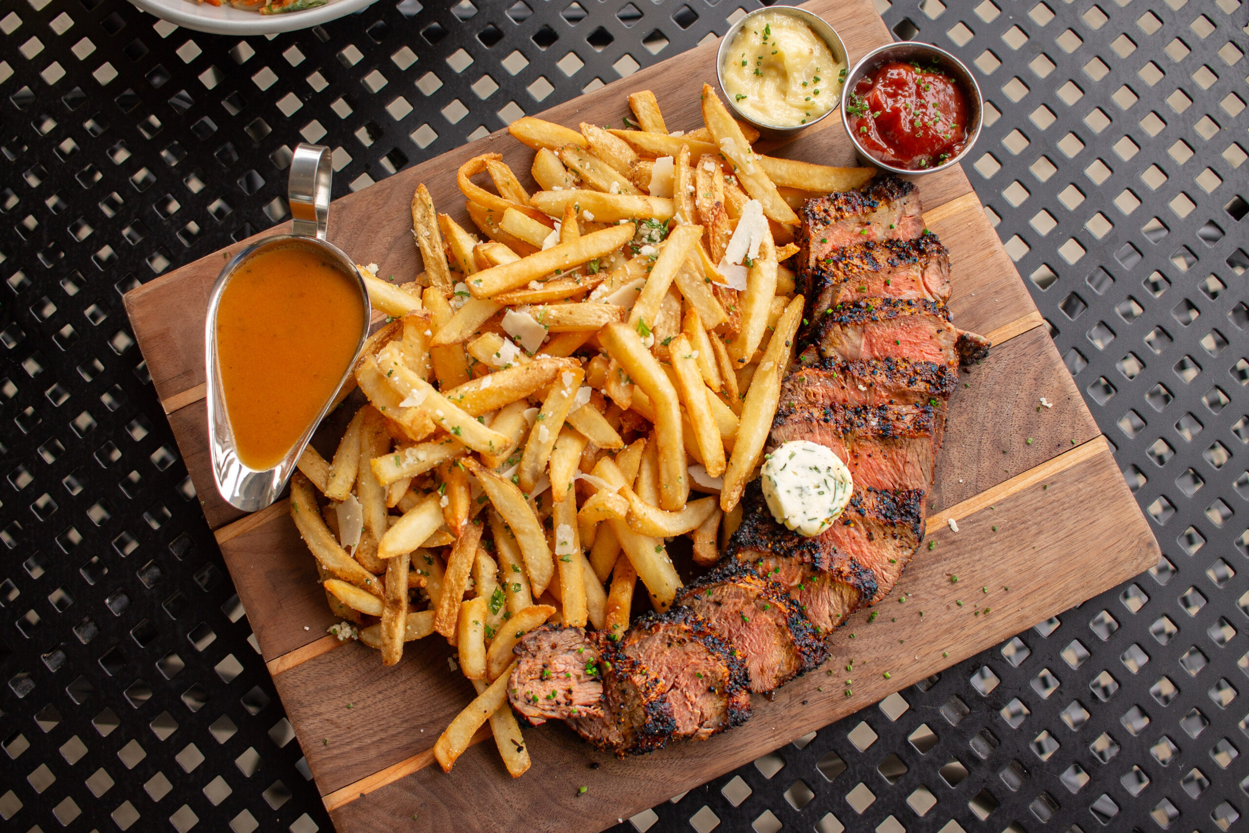 steak frites share board on the patio at the Terrace at Delaware Park Buffalo NY